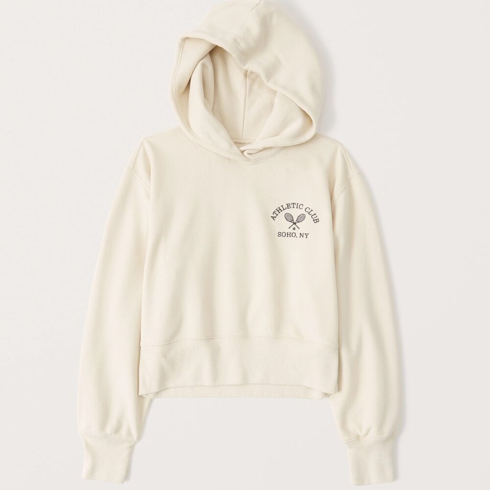 abercrombie cream cropped hoodie featuring “athletic club soho, ny”